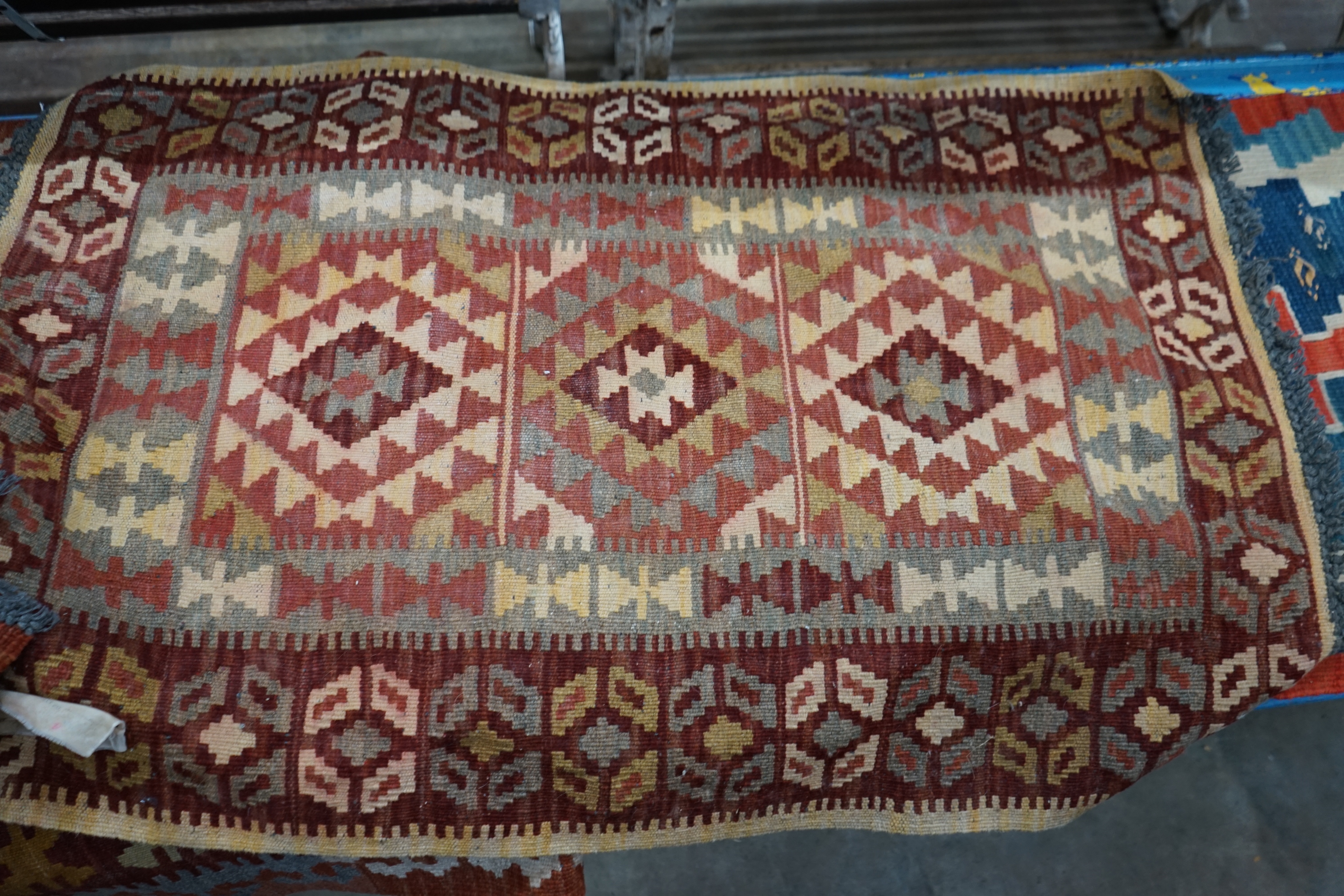 A Kelim flatware runner, 280 x 80cm and two smaller Kelim flatweave rugs